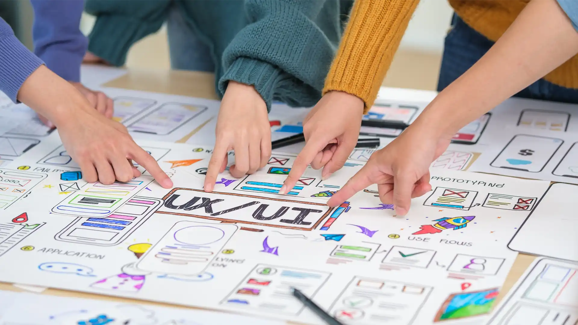 A creative woman designer and a developer collaborating in a modern workspace to build a mobile-responsive website, representing the operational readiness and technical standards required for trustworthy US B2B websites.
